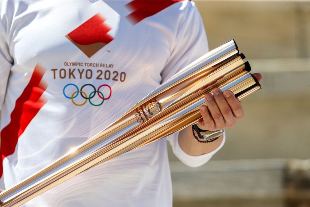 олимпийский огонь спрятали в Токио факел